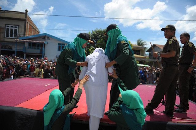 Woman screams in pain during caning in Indonesia’s Aceh