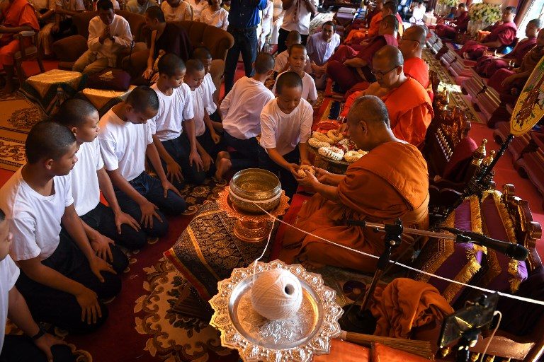 Thai cave boys leave Buddhist monastery after honoring dead rescuer