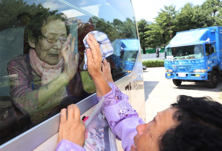 FAREWELL. South Koreans (on the bus) wave farewell to their North Korean relatives  through the window at the end of a 3-day family reunion event at North Korea's Mount Kumgang resort on August 22, 2018. Photo by Yonhap/AFP   
