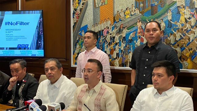 CLOSER LOOK. The painting behind Cayetano depicts him kneeling as other lawmakers pray over him. Photo by Mara Cepeda/Rappler 