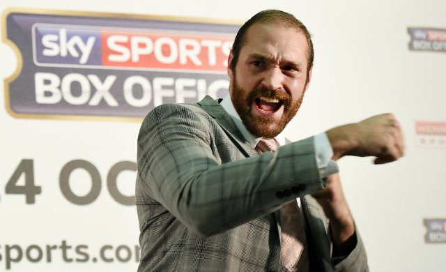 Heavyweight champ Tyson Fury plays ring card boy for cousin’s fight