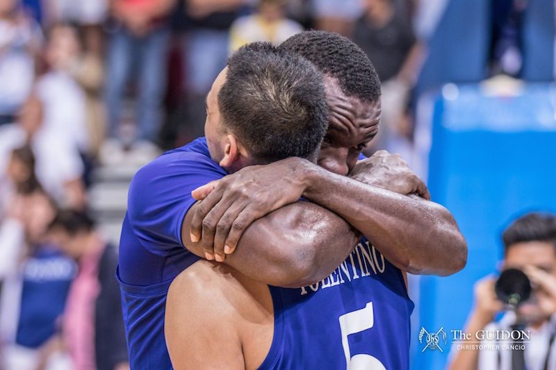EMOTIONS. Chibueze Ikeh hugs Vince Tolentino as he realizes that this is not their last game in the UAAP. Photo by Christopher Cancio/The GUIDON.   