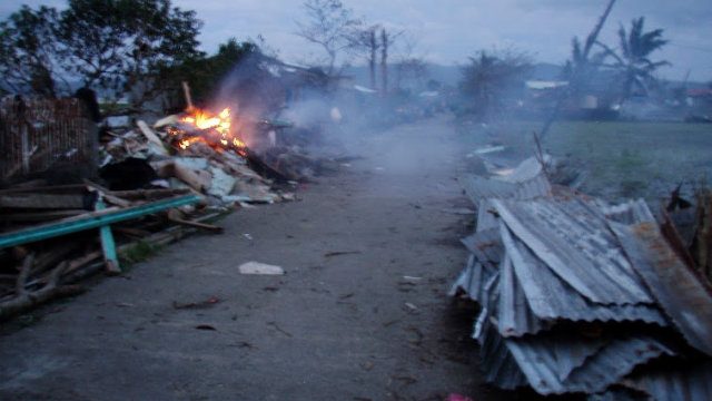 FIRE AND STEEL. Corrugated roofing materials and bits of wood lie along a street in Victoria, Oriental Mindoro. Image courtesy of Myles Delfin.  