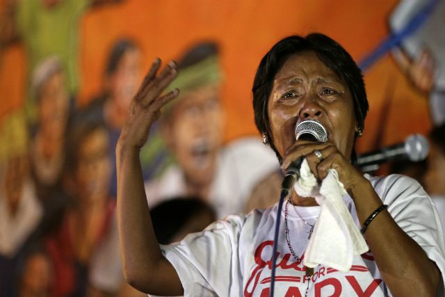 PAIN AND RAGE. Celia Veloso, mother of Philippine death-row prisoner Mary Jane Veloso, speaks during a protest near the Philippines' presidential palace to mark Labor Day on May 1, 2015. Photo by Ritchie Tongo/EPA   