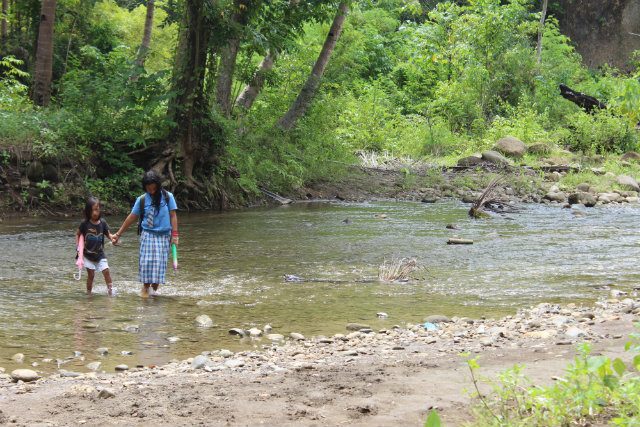 LONG WALKS. In Malapatan, Sarangani province, indigenous children endure long walks - between 14 to 20 kilometers – to reach the school.  