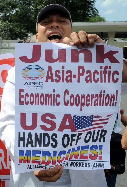 ANTI-TPP. Filipino health workers protest in front of the US embassy in Manila on November 6, 2015. The group expressed their strong opposition to the TPP and the APEC summit as they believe that the US will push the TPP agenda in APEC. Photo by Jay Directo/AFP 