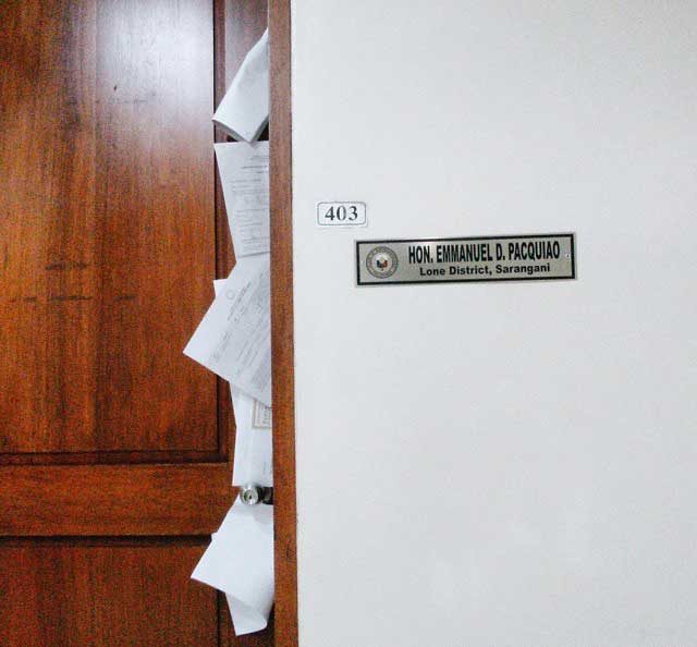 ABSENT. Several documents remain uncollected outside Sarangani representative Pacquiao’s office. Photo by Abigail Abigan.   