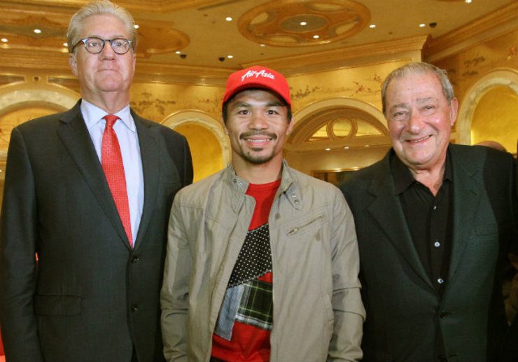 Manny Pacquiao poses for a photo with The Venetian's Ed Tracy (L) and promoter Bob Arum (R). Photo by Chris Farina - Top Rank