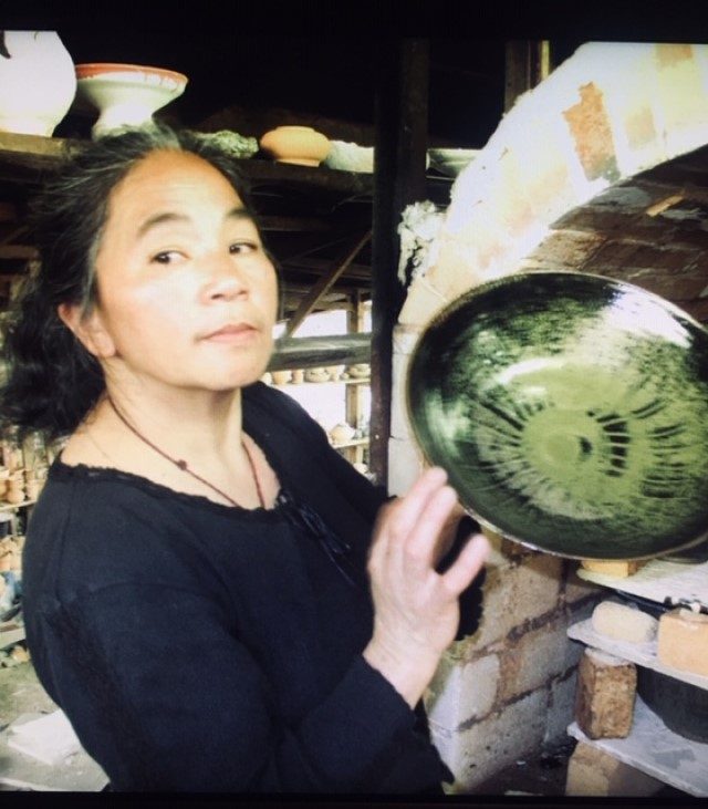 ARTIST. Tessie Baldo poses with one of her glazed plates. Photo from Sierra Madre Pottery Studio 