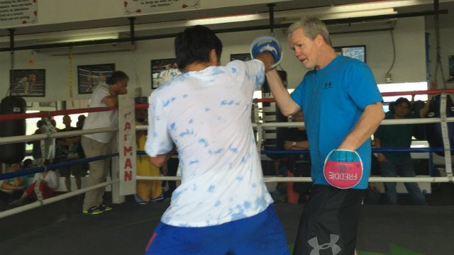 Manny Pacquiao lands a right jab while working the punch mitts with Freddie Roach. Photo by Ryan Songalia/Rappler 