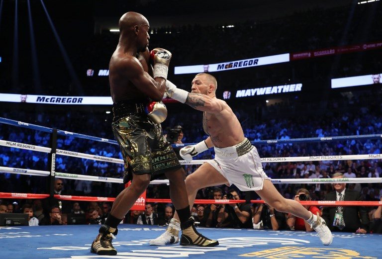 BOXER WINS BOXING MATCH. McGregor looks professional early on but Mayweather has too much skill and will for the UFC star. Photo by Christian Petersen/Getty Images/AFP   