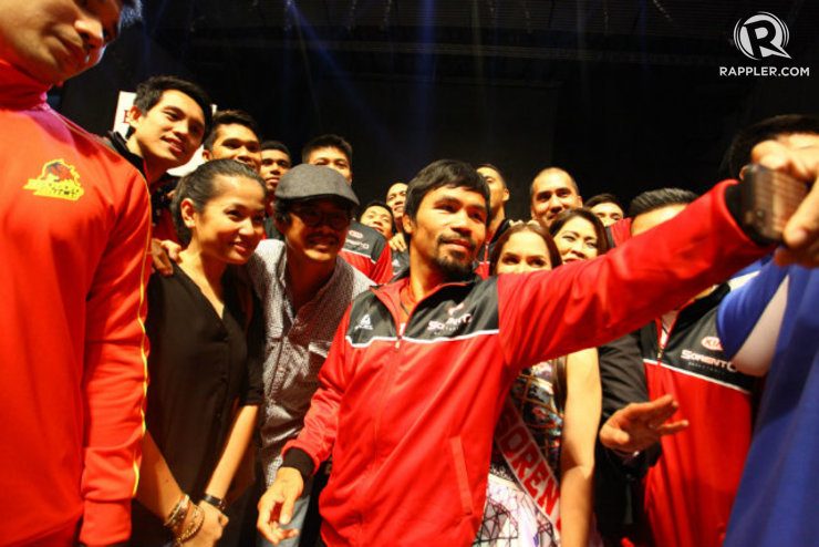 Kia Sorentos playing coach Manny Pacquiao snaps a selfie with the team. Photo by Josh Albelda