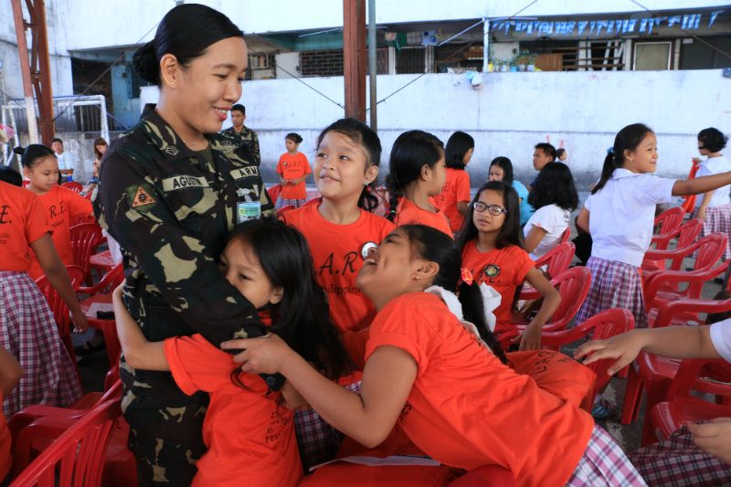 SOLDIER TEACHER. Members of the Philippine army moonlight as teachers for almost two months under the DARE program. Photo courtesy of the Armed Forces of the Philippines 