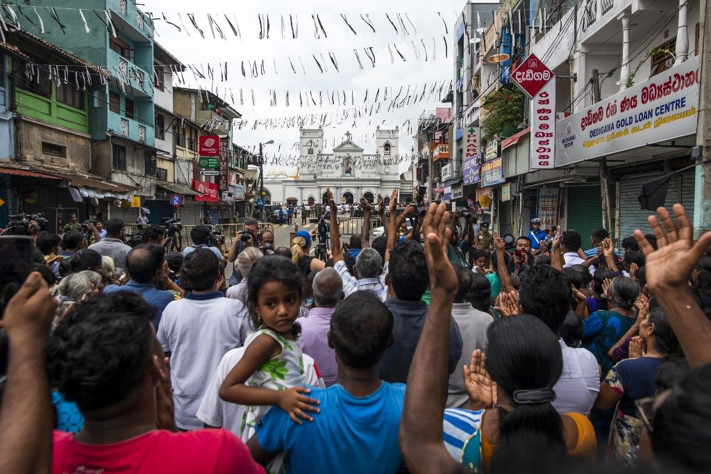 Tears and troops on streets as Sri Lanka mourns suicide bomb dead
