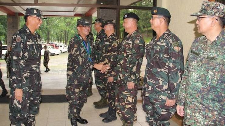 OLD COMMAND. Armed Forces chief of staff greets soldiers in his former camp at Nolcom, Tarlac.