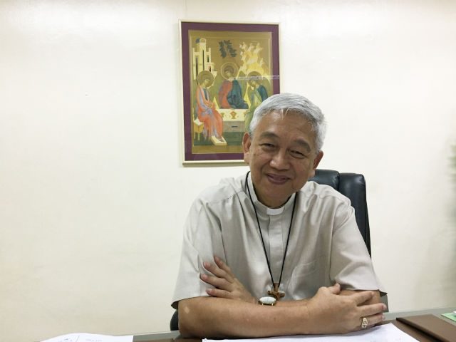 FIGHT NOT OVER. Manila Auxillary Bishop Broderick Pabillo grins even after the Church lose the first battle against the death penalty bill. Photo by Mara Cepeda/Rappler 