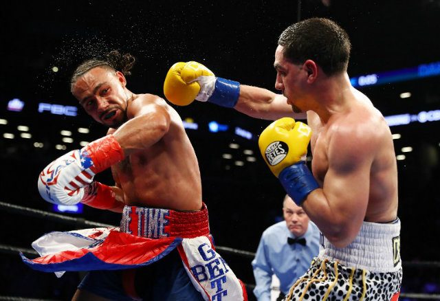 Keith Thurman throws a left hook against Danny Garcia in their welterweight title unification bout last month which Thurman won by split decision. Photo by Al Bello/Getty Images/AFP   