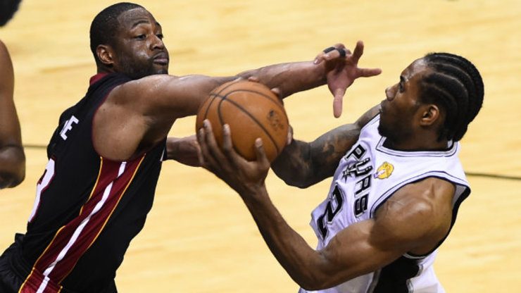 Kawhi Leonard (R) outplayed Dwyane Wade (L) en route to Finals MVP honors. Photo by Larry W. Smith/EPA