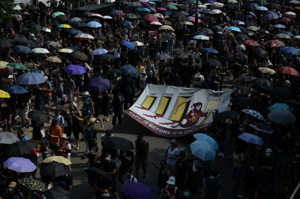 DEFIANCE. People take part in a pro-democracy march in the Tsim Sha Tsui district in Hong Kong on October 20, 2019. Photo by Ed Jones/AFP 