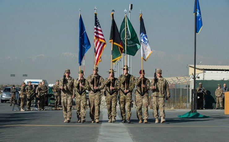 NATO lowers flag on its Afghan war, but insurgency boils