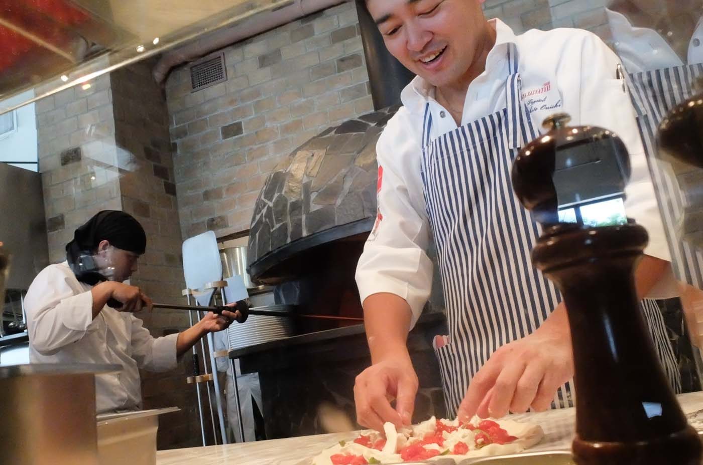 BEST PIZZA. Neapolitan Pizzaiolo 2006, Makoto Onishi prepares pizzas himself for guests.  