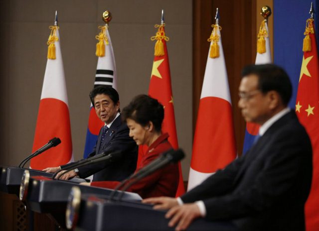 S. Korea, China, Japan put hostility aside at rare summit