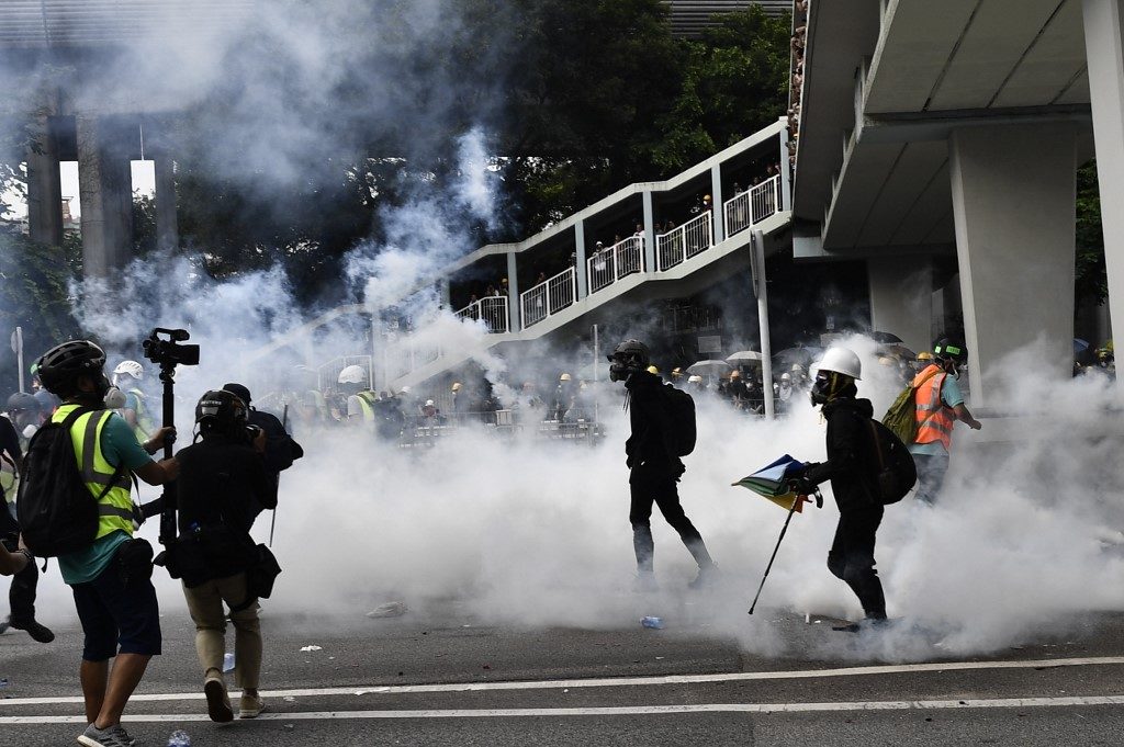 Police fire tear gas, rubber bullets at Hong Kongers protesting ‘triad’ attack