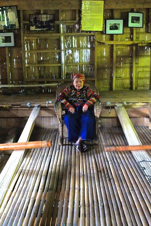 WORK SPACE. Near Lang Dulay’s feet are  bamboo contraptions used for weaving designs. 