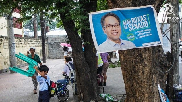 POSTERS. A political campaign poster hangs from a tree along UN Avenue in Manila on February 13, 2019. Photo by Lito Borras/Rappler 