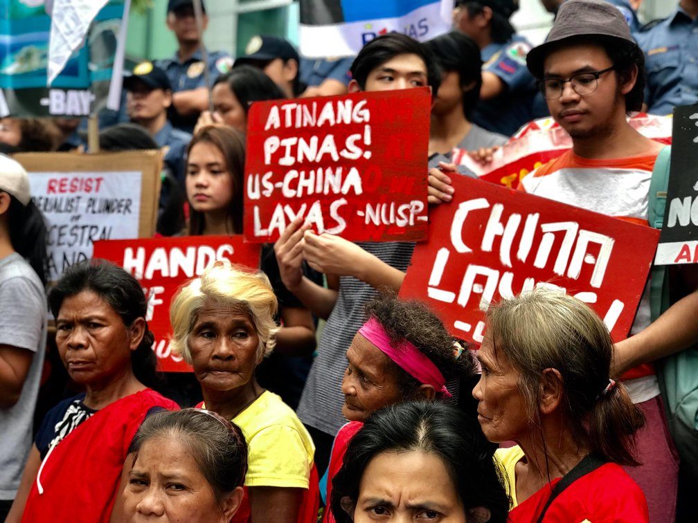 LAND IS OURS. Elderly members of the Dumagat Tribe from the Sierra Madre mountains join various groups at a protest action in Makati City to fight for their ancestral land. Photo by Kurt Dela Peña/Rappler.com 