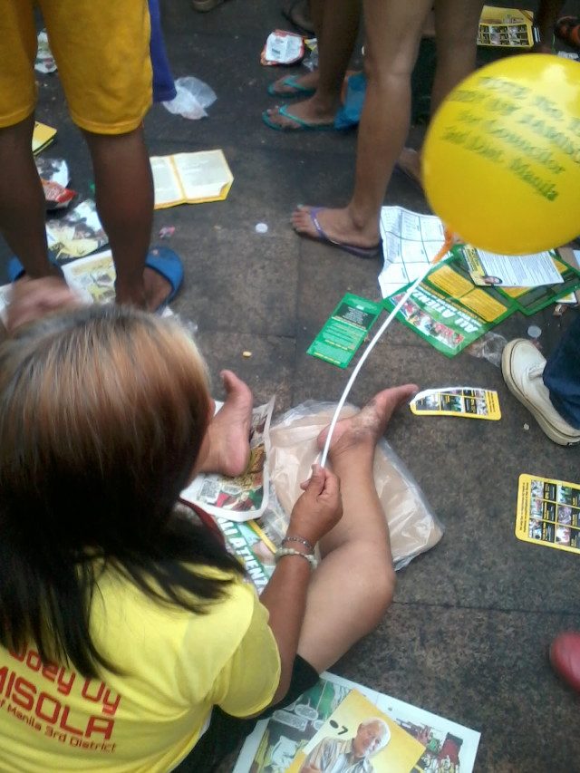 LITTERING. Flyers and leaflets are strewn on the ground during Alfredo Lim's proclamation rally in Plaza Miranda. Photo from EcoWaste Coalition  