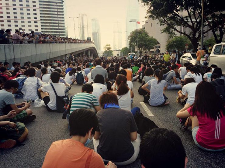 PEACEFUL. Protests began peacefully. Students are unaware that police would begin using tear gas. Photo by Jason Y Ng