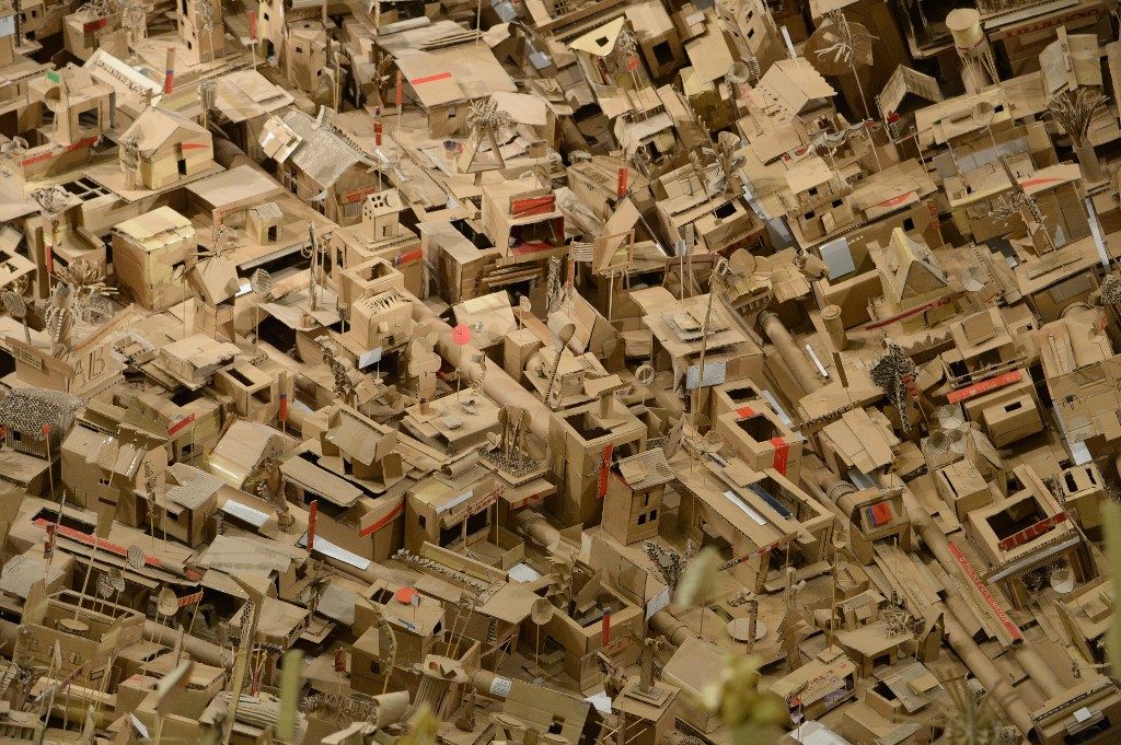 INTRICATE. The artists used cardboard, a significant material in Filipinos' lives. Photo by Ted Aljibe/AFP 