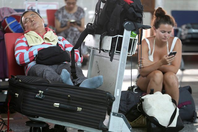 STUCK. Tourists are stuck in Bali as airport closes due to volcanic eruption. Made Nagi/EPA  