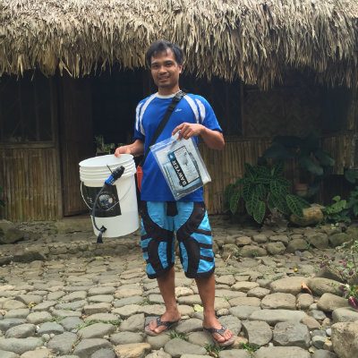 COMMUNITY SPRING. Kagawad Jigger holds up a portable water filter that can provide clean water to 100 families for 5 years. The filter was donated to a local Dumagat community in Bgy. Calawis, Antipolo City as part of World Water Day 2015. 