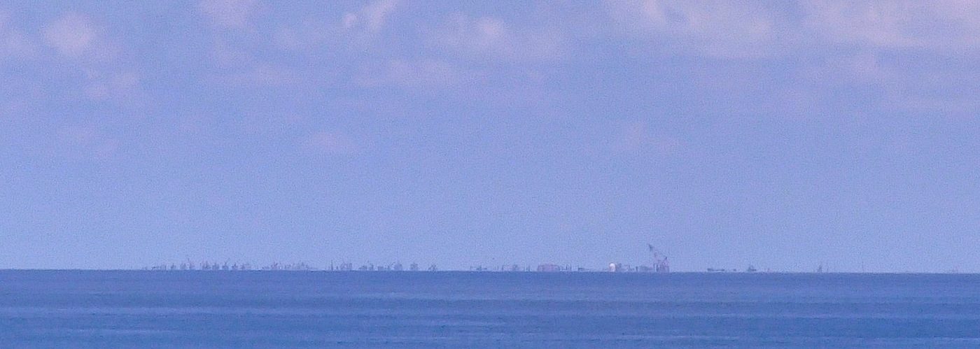 CHINA'S PRESENCE. Filipinos in Pag-asa island can watch the massive reclamation in nearby Subi (Zamora) Reef. Carmela Fonbuena/Rappler      