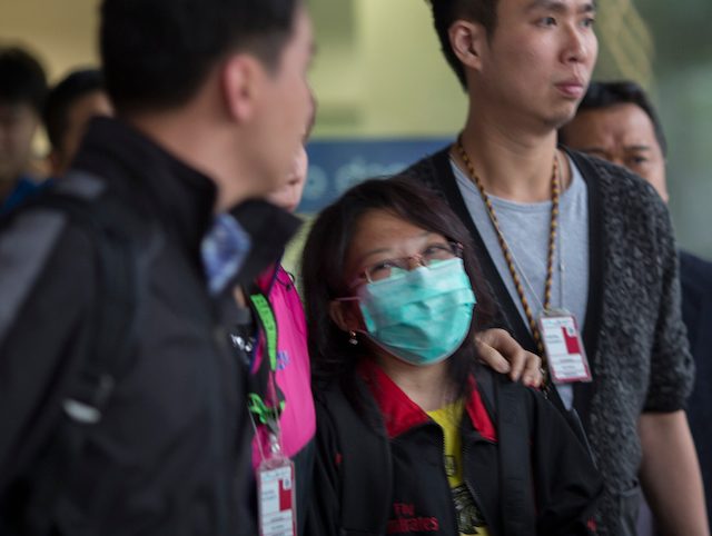 On April 7, Erwiana, seen here with Indonesian consulate staff at the Hong Kong airport, returns to provide her testimony against Law. Photo by EPA 