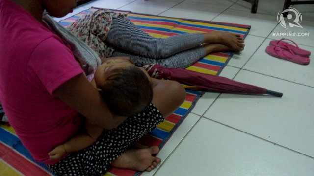 BABY. M with her baby and her sister during an NGO workshop. Photo by Fritzie Rodriguez/Rappler   