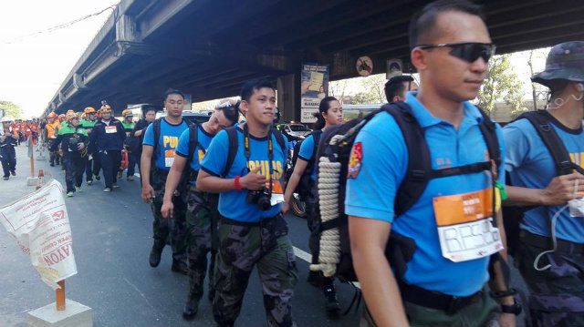 SERVE AND PROTECT. The Philippine National Police Rescue March contingent below the Skyway. Image courtesy Martin Aguda 