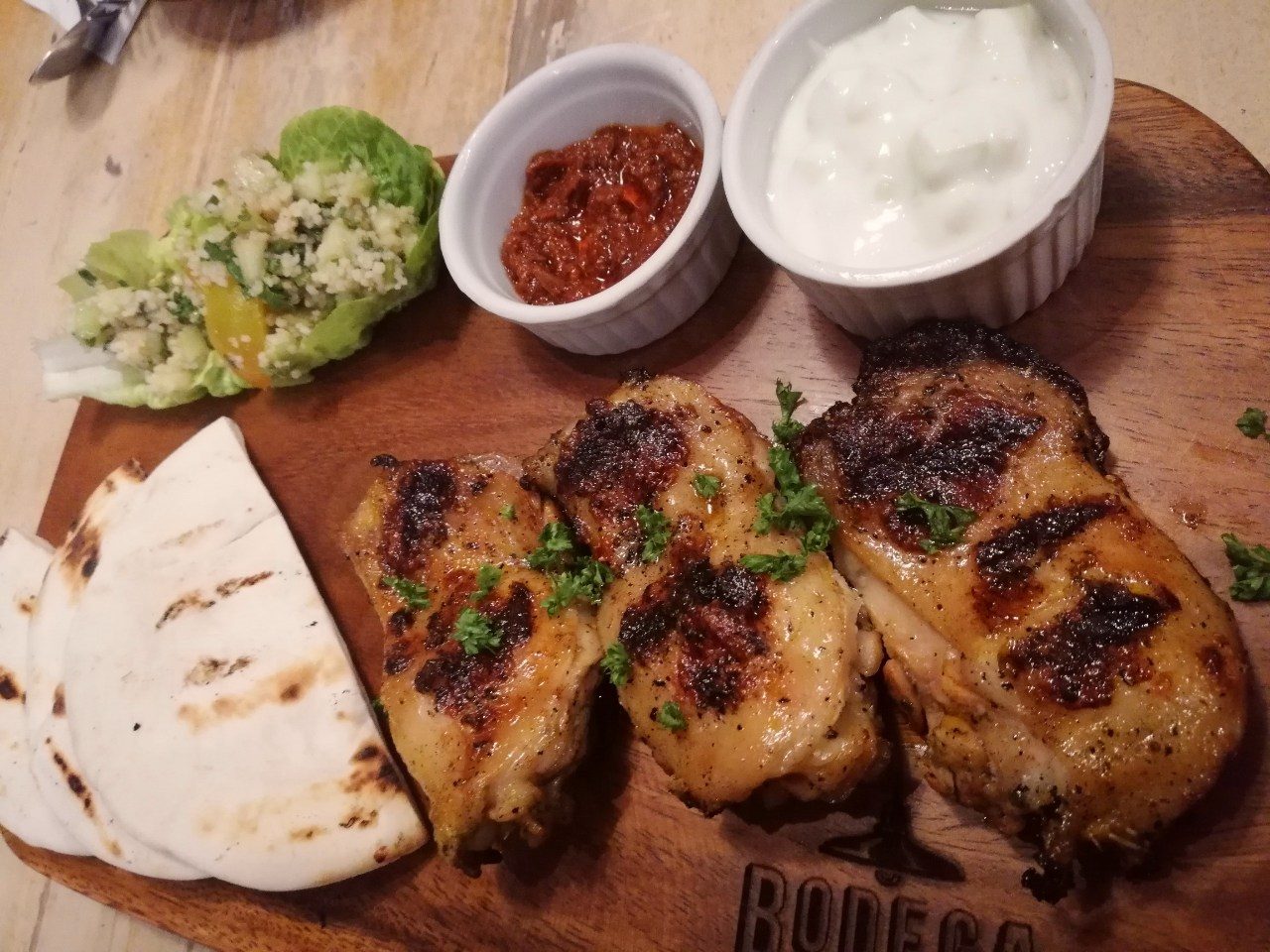 A CHICKEN DINNER WINNER. While the inasal chicken thighs are grilled to perfection, the Greek sides also shine as a refreshing complement to the chicken's charred flavor. Photo by Steph Arnaldo/Rappler 
