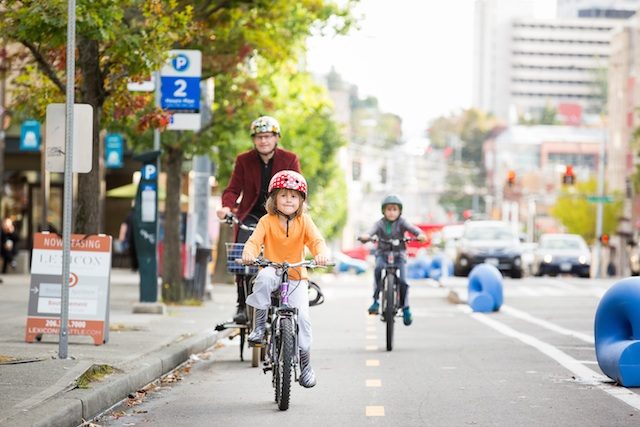 SAFE IN SEATTLE. A protected bicycle lane shows that children on bicycles are as important as citizens in cars. Photo courtesy of Adam Coppola Photography 