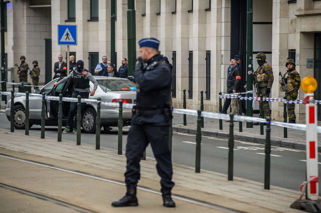 Mourning Belgium in frantic hunt for 2 attacks suspects