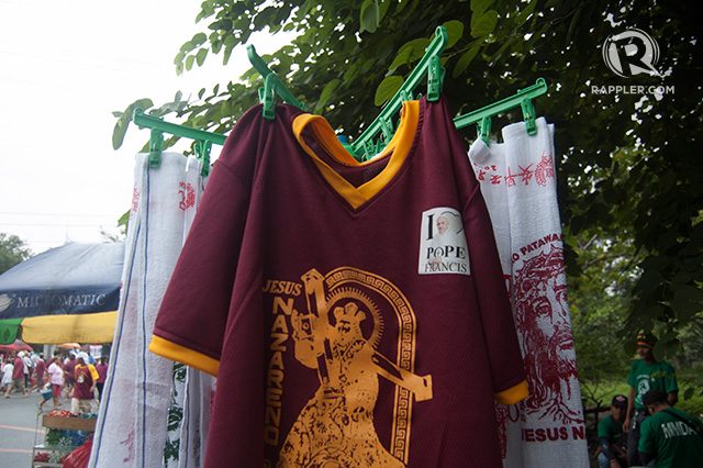 POPE/NAZARENE SHIRT. John Tagana says his shirts featuring the face of the Black Nazarene and the Pope are his bestsellers. Photo by Honey Albiso