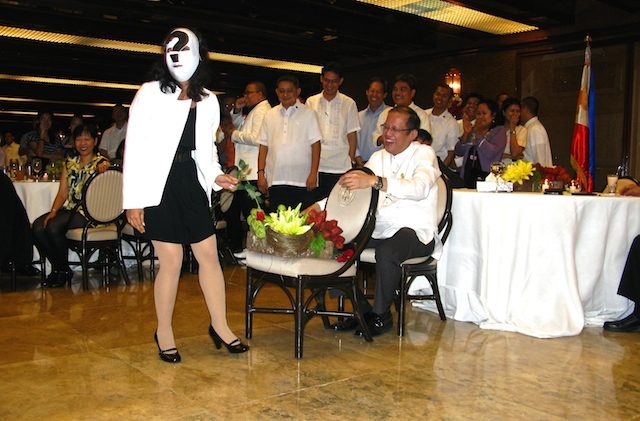 'MYSTERY WOMAN.' In a performance, members of the Malacanang Press Corps give the bachelor president a 'happy ending' – finding love, at last – at his first Christmas party for the MPC in 2010. Photo from Mia Gonzalez/Rappler   