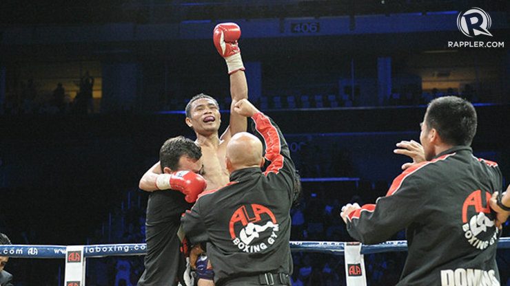 Donnie Nietes is lifted up by his trainers after knocking out Fuentes. Photo by Denmark Dolores/Rappler