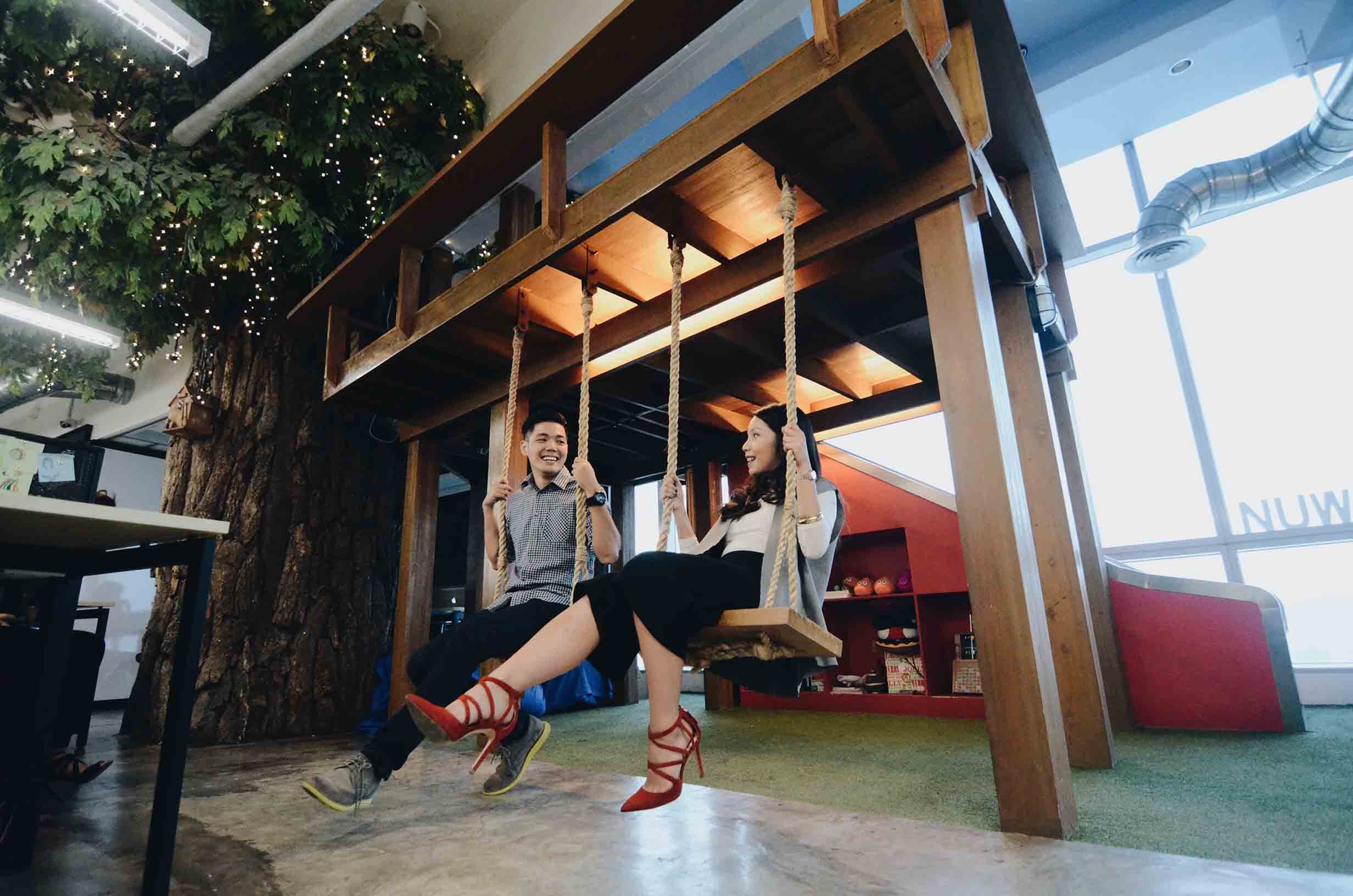 Besides a foosball table, a slide and scooters for employees to play with, there are swings where employees can simply hang around. Photo by NuWorks Interactive Labs 
