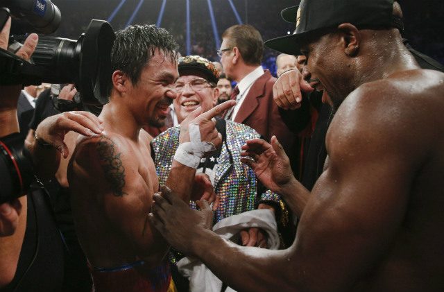 LIGHT MOMENT. Floyd Mayweather Jr. (R) and Philippine Manny Pacquiao share a light moment following their welterweight unification championship bout at MGM Grand Garden Arena in Las Vegas, Nevada, USA, on May 2, 2015. Photo by Esther Lin/EPA 