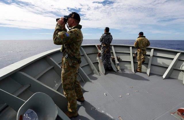 Australia warns of long haul as hunt for MH370 goes on