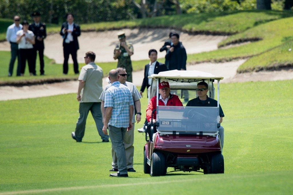 Trump tees up Japan summit with Abe golf match