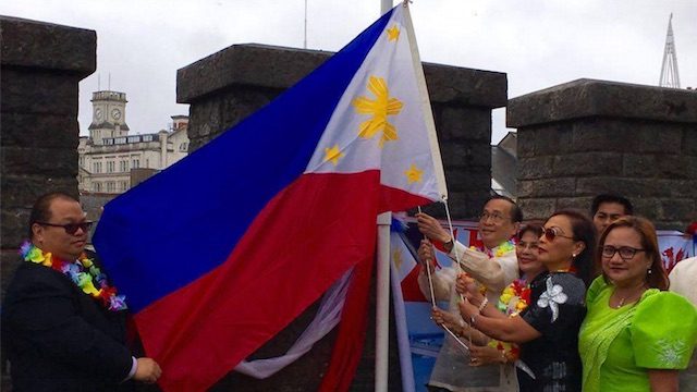 JUNE 12 FLAG-RAISING. The Filipino community in Wales raises the Philippine flag outside Cardiff Castle. Photo from the PH embassy Facebook page  